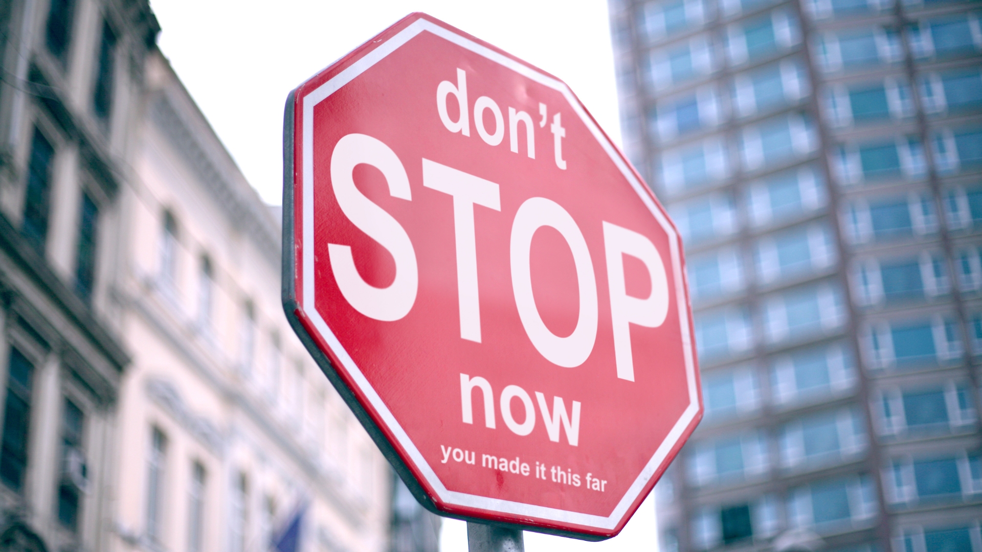 Stop sign with the words 'don't Stop now, you made it this far' on it